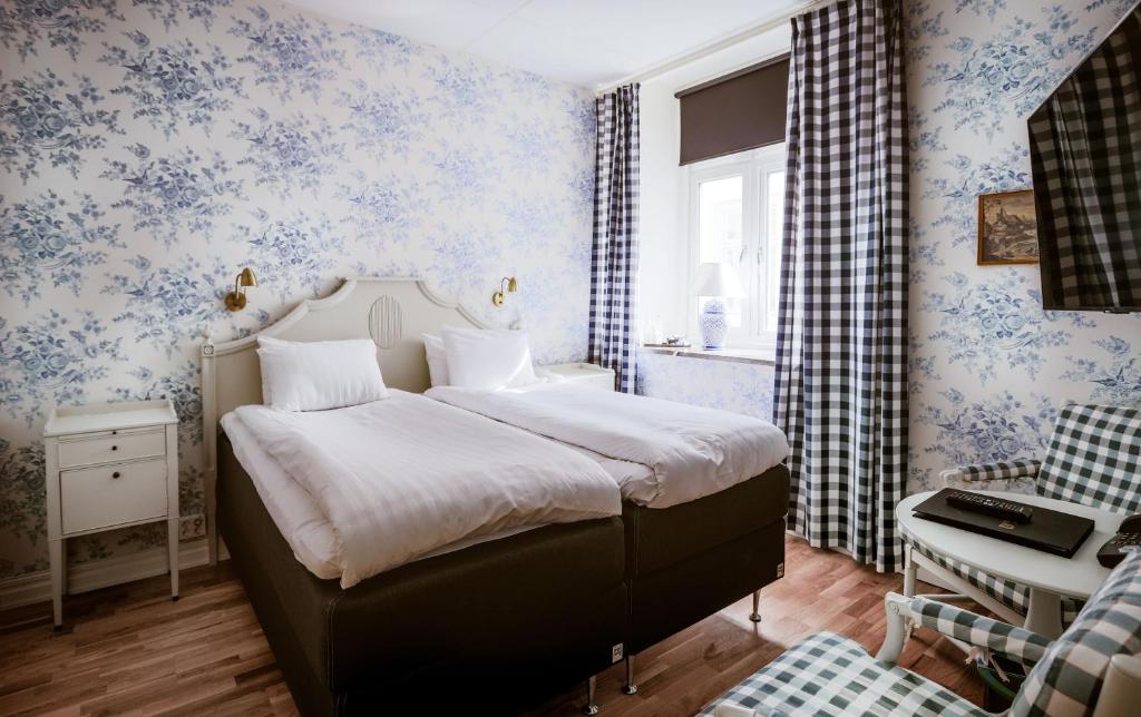 Двухместный (Двухместный номер с 1 кроватью или 2 отдельными кроватями - В дополнительном здании) отеля Vadstena Klosterhotell Konferens & Spa, Мутала