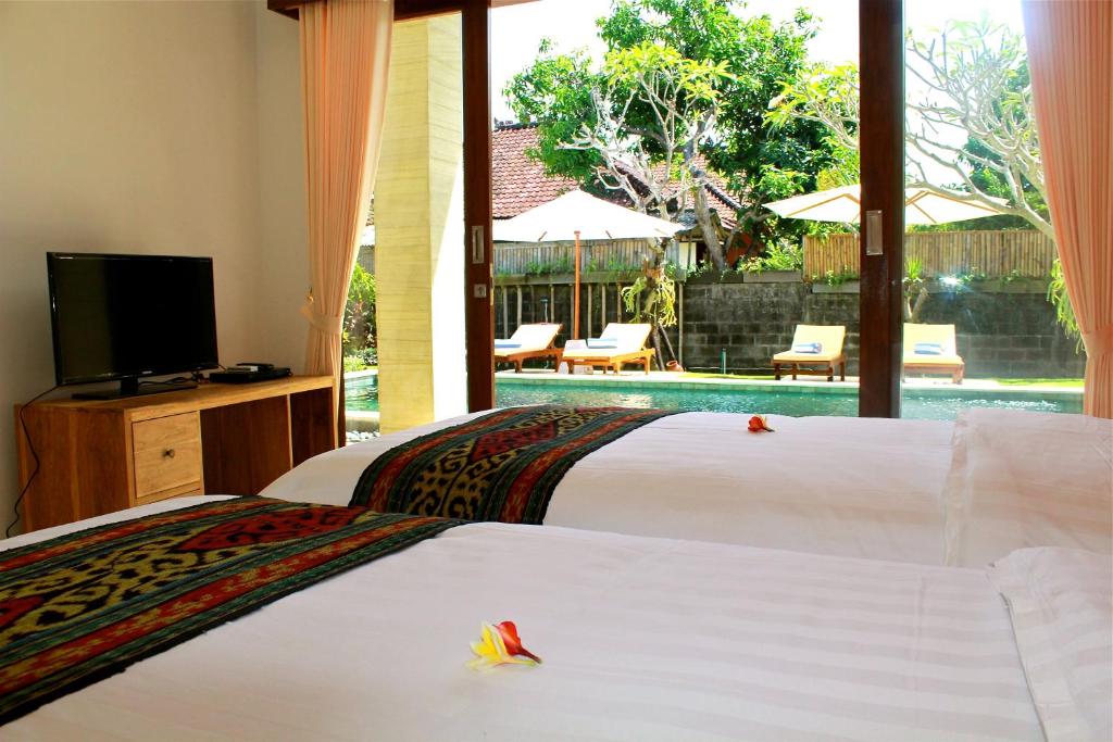 Двухместный (Улучшенный двухместный номер с 2 отдельными кроватями) гостевого дома The Daun Bali, Чангу