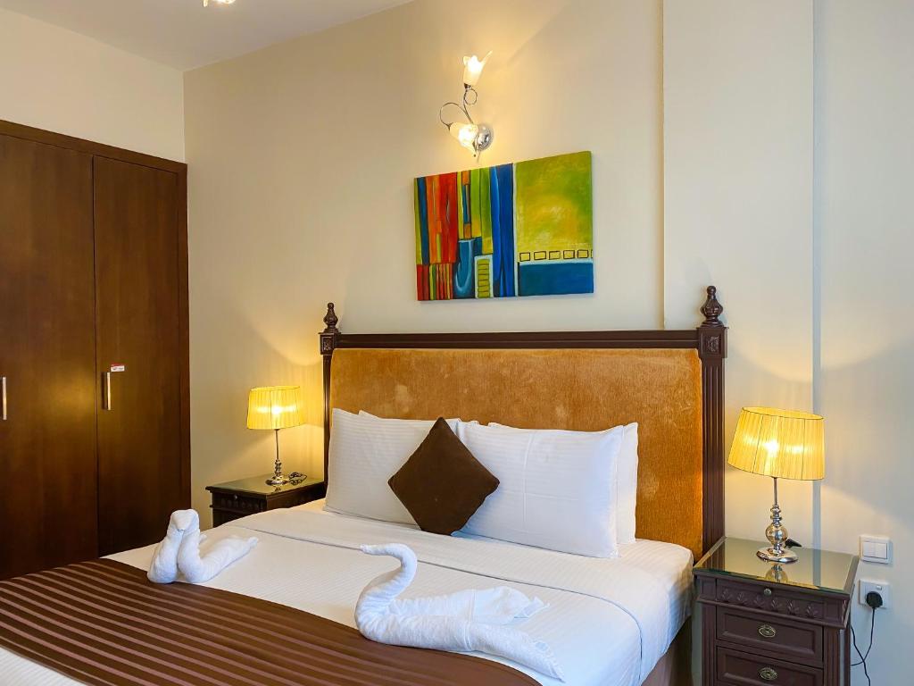 Апартаменты (Улучшенные апартаменты с одной спальней (кровать размера «king-size» или 2 односпальные кровати)) апарт-отеля Auris Boutique Hotel Apartments, Дубай