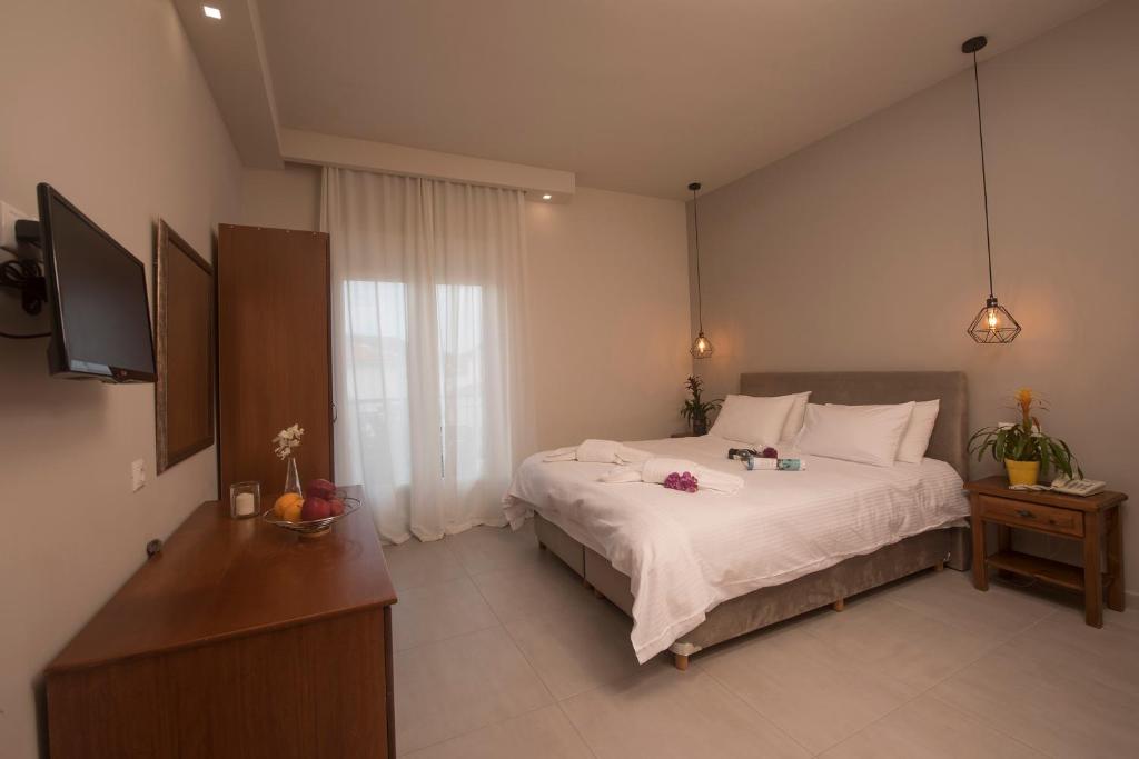 Двухместный (Улучшенный двухместный номер с 1 кроватью или 2 отдельными кроватями) отеля Filoxenia Hotel, Волос