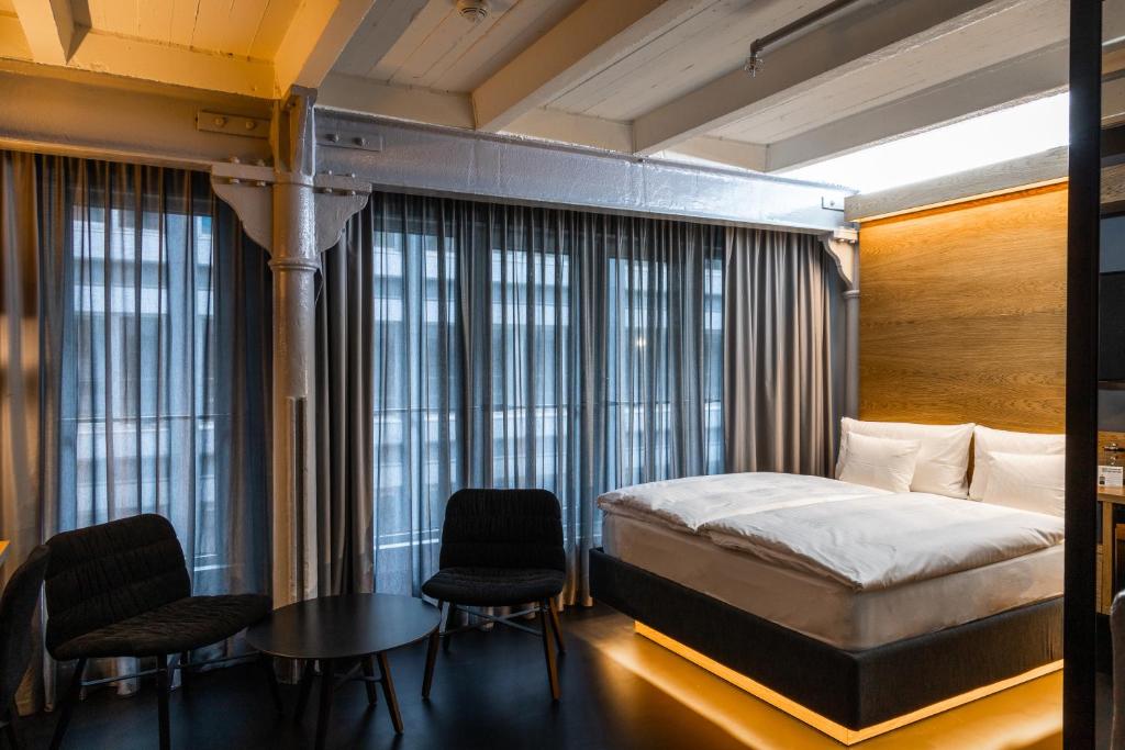 Двухместный (Небольшой двухместный номер с 1 кроватью или 2 отдельными кроватями) отеля GINN Hotel Hamburg Elbspeicher, Гамбург