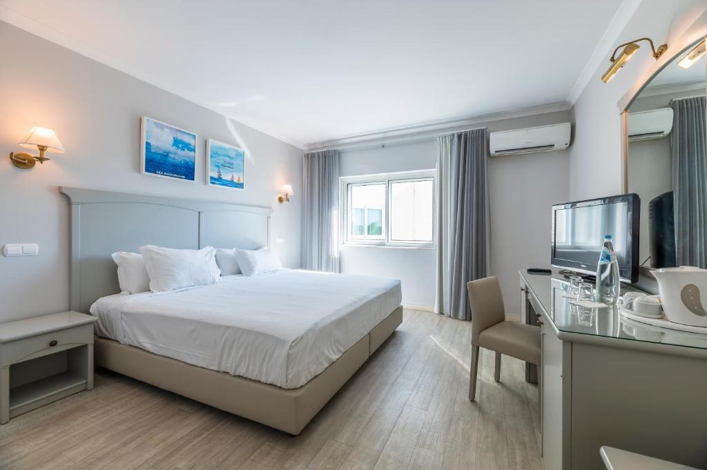 Двухместный (Классический двухместный номер с 1 кроватью или 2 отдельными кроватями) отеля Velamar Budget Boutique Hotel, Албуфейра