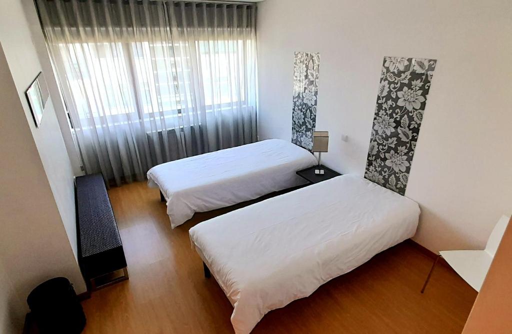Двухместный (Двухместный номер с 2 отдельными кроватями - Подходит для гостей с ограниченными физическими возможностями) хостела HI Hostel Vila Nova de Cerveira - Pousada de Juventude, Вила-Нова-ди-Сервейра
