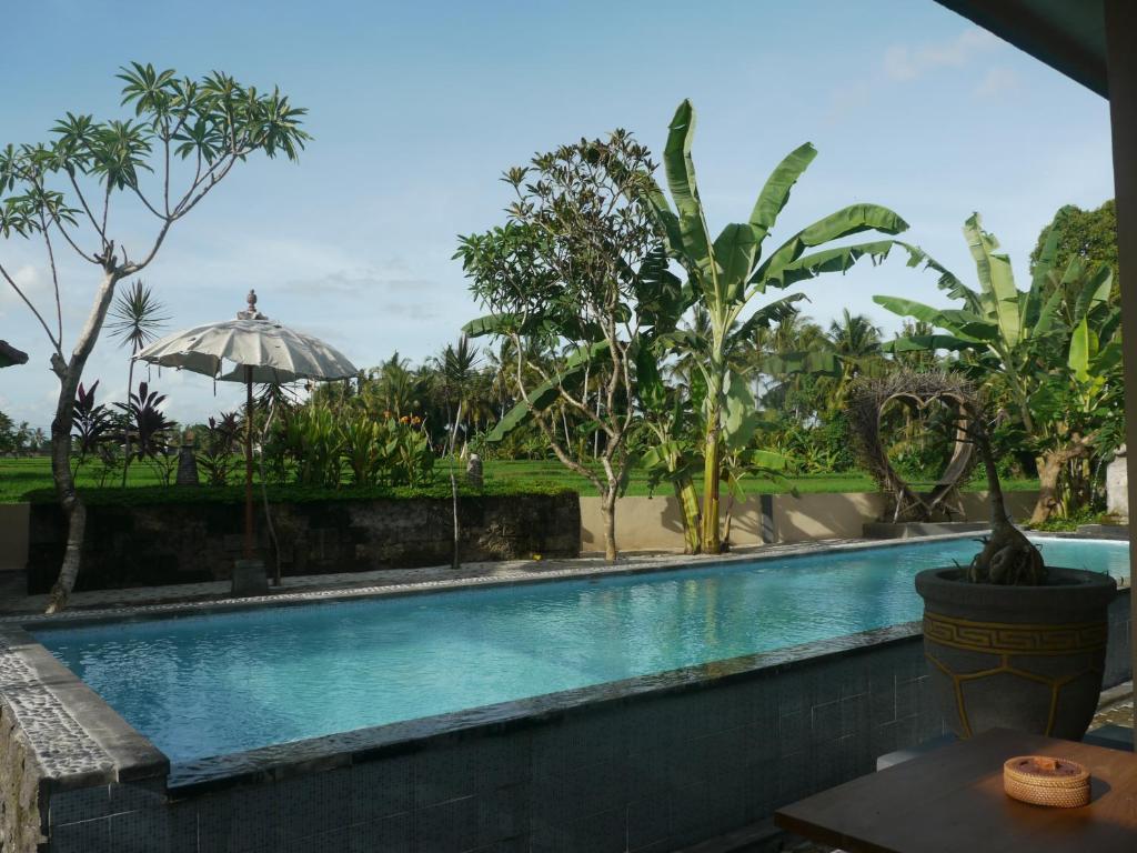Сьюит (Люкс с видом на бассейн) виллы Asri Sari Resort, Убуд