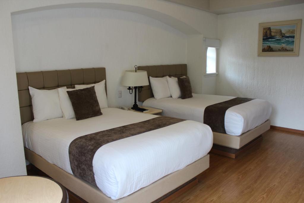 Двухместный (Стандартный двухместный номер с 2 двуспальными кроватями) отеля Meson del Valle, Самора-де-Идальго