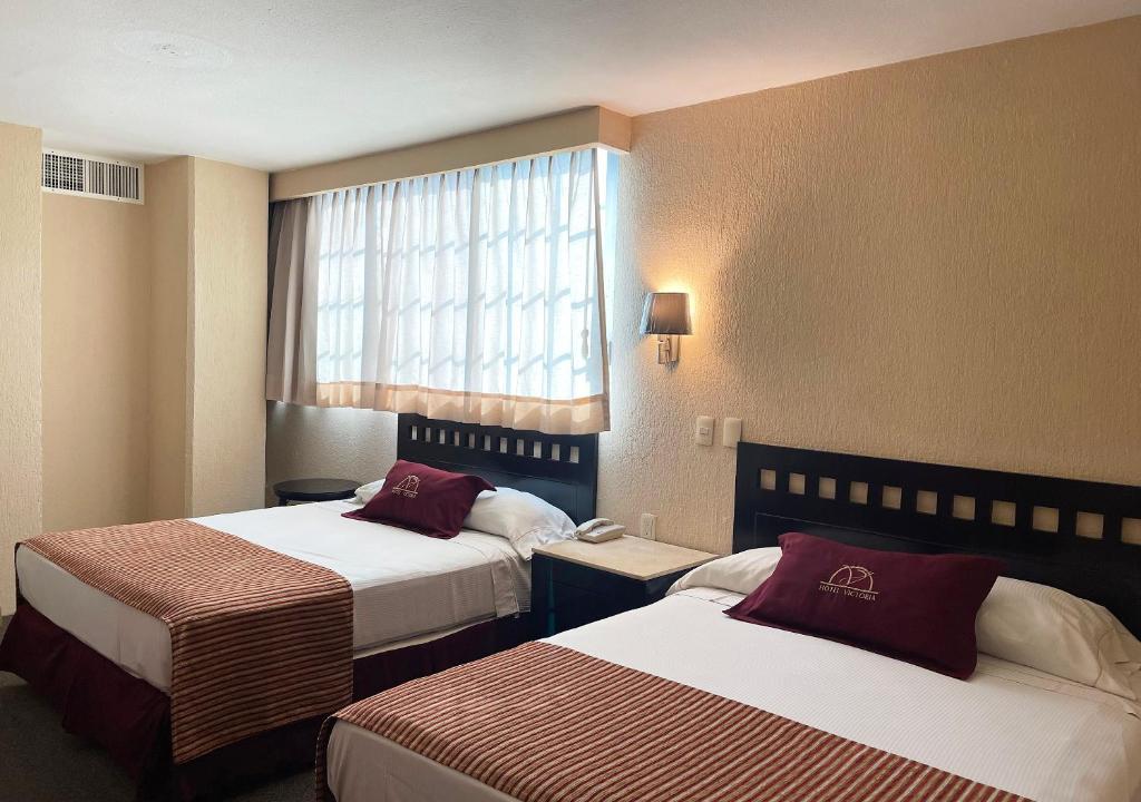 Двухместный (Улучшенный номер с 2 кроватями) отеля Hotel Victoria Poza Rica, Поса-Рика-де-Идальго
