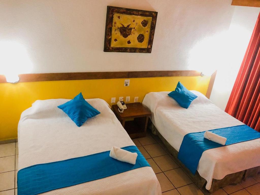 Двухместный (Двухместный номер с 2 двуспальными кроватями) отеля Hotel Pez Vela, Мансанильо
