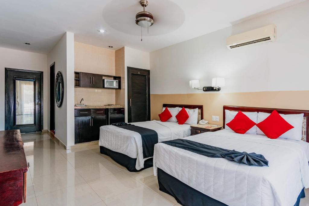 Двухместный (Улучшенный двухместный номер с 2 двуспальными кроватями) отеля Koox Siglo 21 Corporate Aparthotel, Мерида