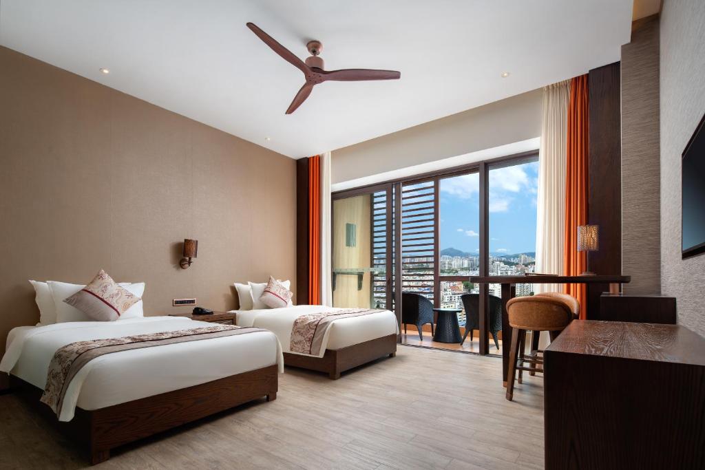 Двухместный (Стандартный двухместный номер с 2 отдельными кроватями) отеля Mangrove Tree Resort World Sanya Bay- Queen Palm Toawers, Санья