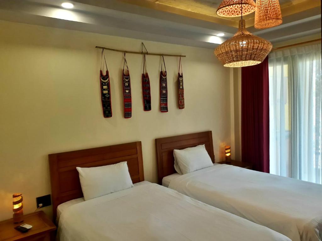 Двухместный (Двухместный номер с 2 отдельными кроватями и балконом) отеля Pink Tulip Hoi An, Хойан