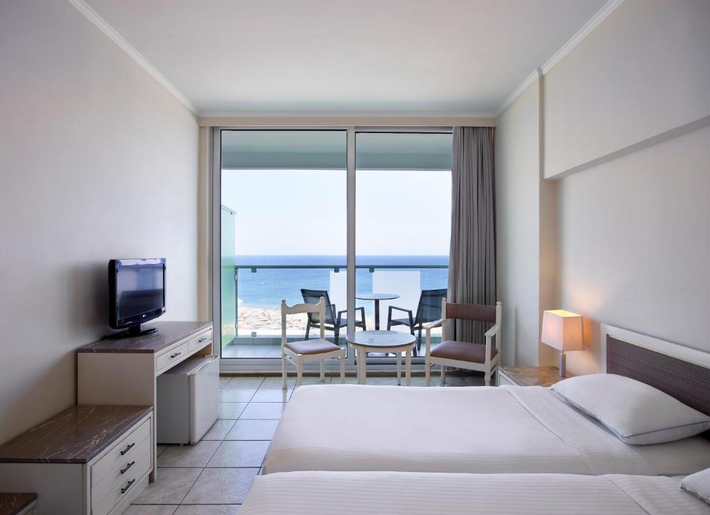 Двухместный (Стандартный двухместный номер с 1 кроватью или 2 отдельными кроватями, вид на море) отеля AQUARIUM VIEW HOTEL, Родос