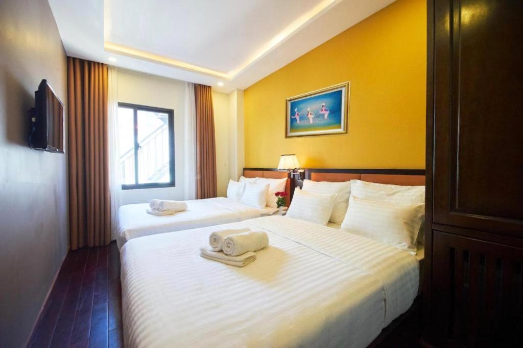 Четырехместный (Улучшенный четырехместный номер) отеля ALADIN Hotel Nha Trang, Нячанг