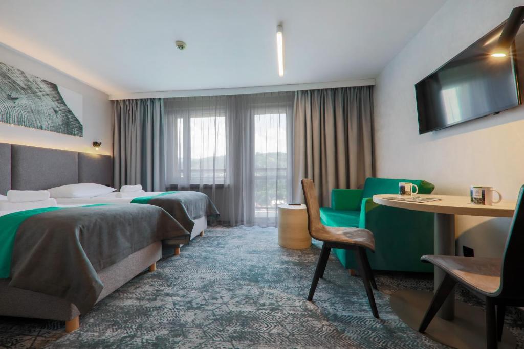 Двухместный (Стандартный двухместный номер с 1 кроватью или 2 отдельными кроватями) отеля Hotel Pod Jedlami, Висла