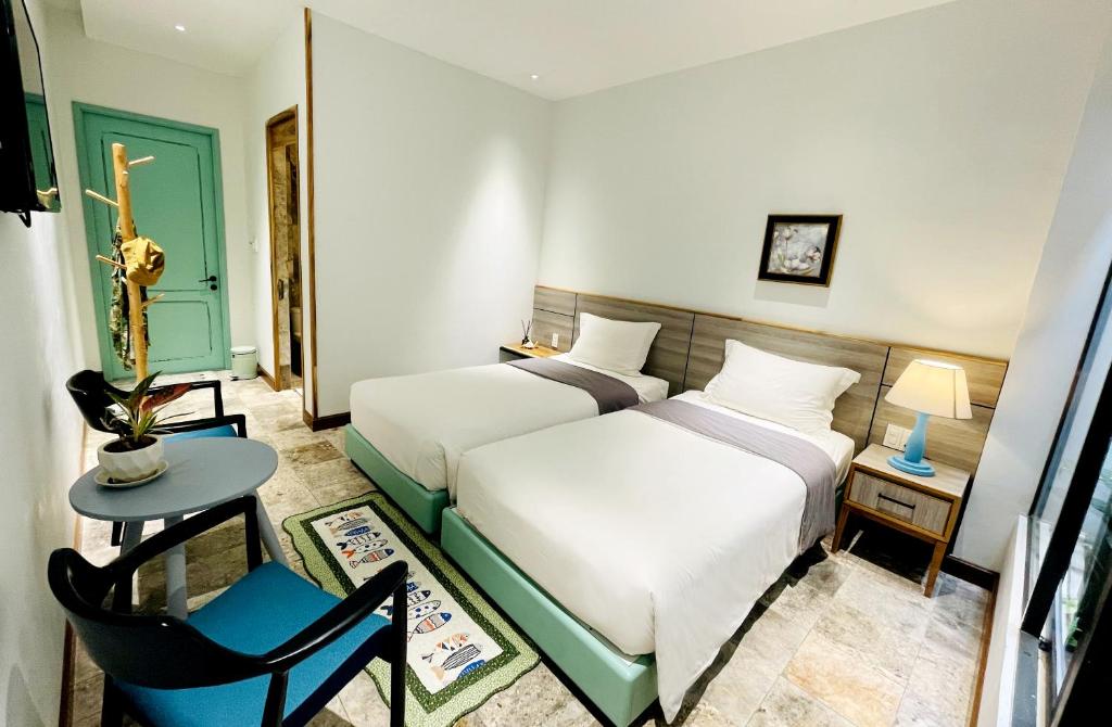 Двухместный (Двухместный номер с 2 отдельными кроватями и собственной ванной комнатой) отеля Côn Đảo House, Кондао