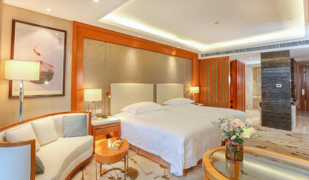 Двухместный (Двухместный номер бизнес-класса с 2 отдельными кроватями и видом на реку) отеля Yiwu Shangcheng Hotel, Иу