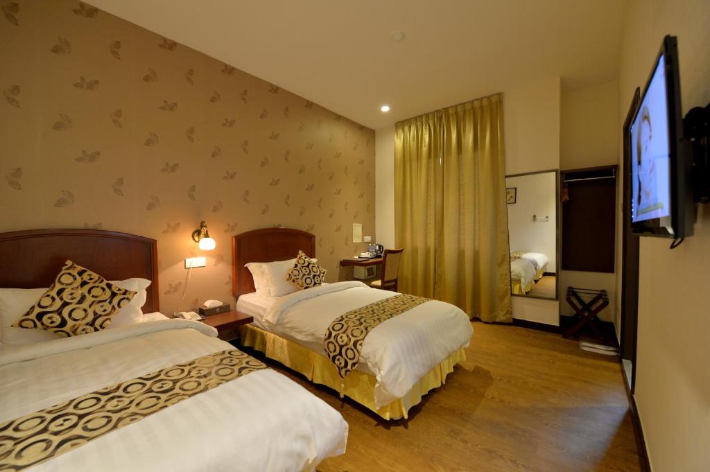 Двухместный (Двухместный номер Делюкс с 1 кроватью или 2 отдельными кроватями) отеля Asiana Hotel, Кота-Кинабалу