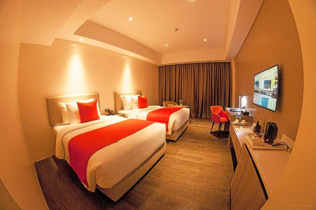 Двухместный (Двухместный номер Делюкс с 2 отдельными кроватями) отеля Acacia Hotel Davao, Давао