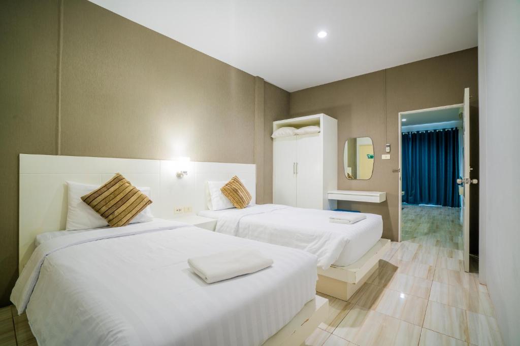 Двухместный (Двухместный номер Делюкс с 2 отдельными кроватями) отеля Paragon Hometel, Сураттхани