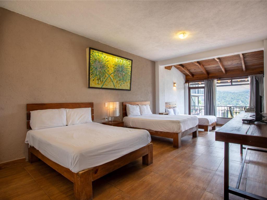 Двухместный (Улучшенный двухместный номер с 2 двуспальными кроватями) отеля Hotel Santa Rosa, Валье-де-Браво