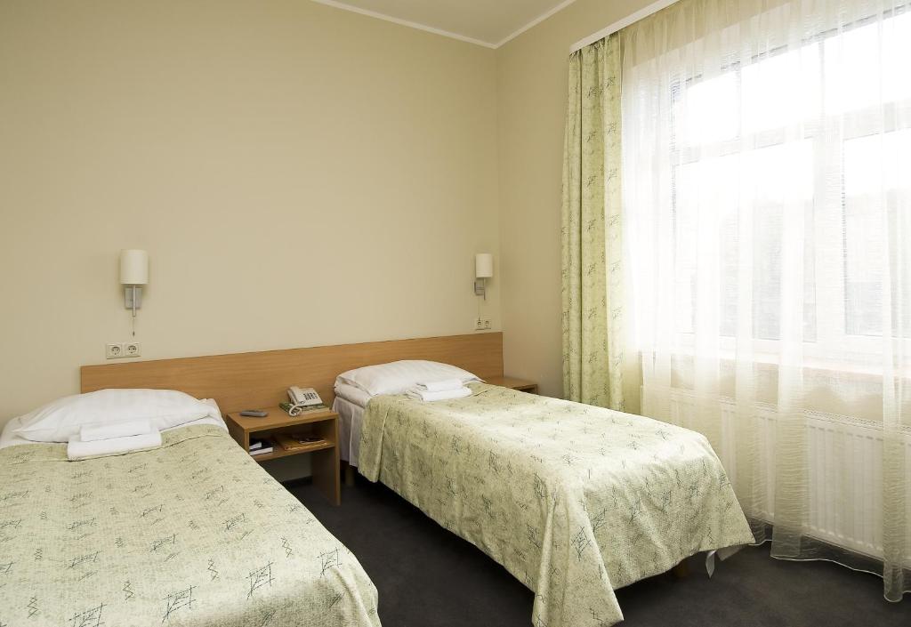 Двухместный (Стандартный двухместный номер с 2 отдельными кроватями) отеля TOSS Hotel, Рига