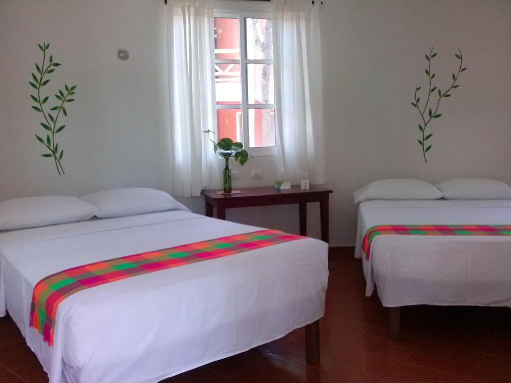 Двухместный (Двухместный номер с 2 двуспальными кроватями) отеля Eco-Hotel Nueva Altia, Санта-Элены