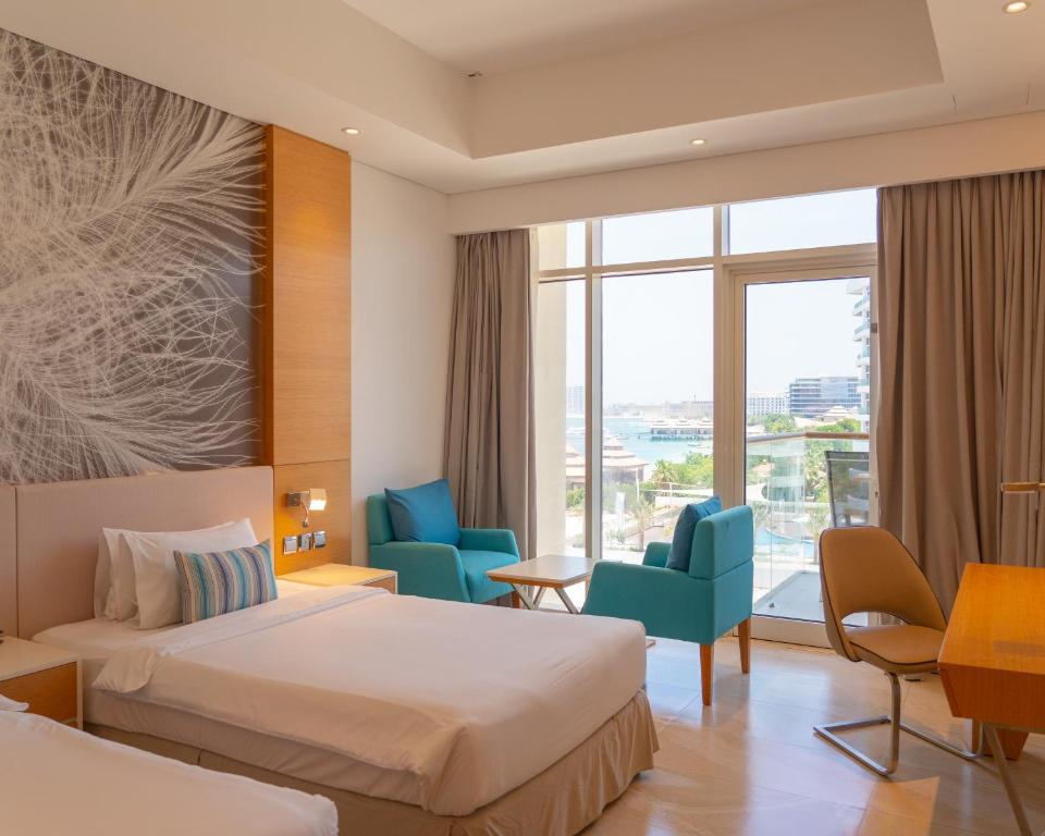 Двухместный (Двухместный номер Делюкс с 1 кроватью, балконом и доступом на собственный пляж отеля) курортного отеля Royal Central Hotel The Palm, Дубай