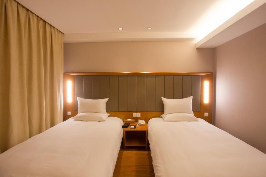 Двухместный (Двухместный номер с 2 отдельными кроватями) отеля JI Hotel Shanghai Railway Station West Tianmu Road, Шанхай