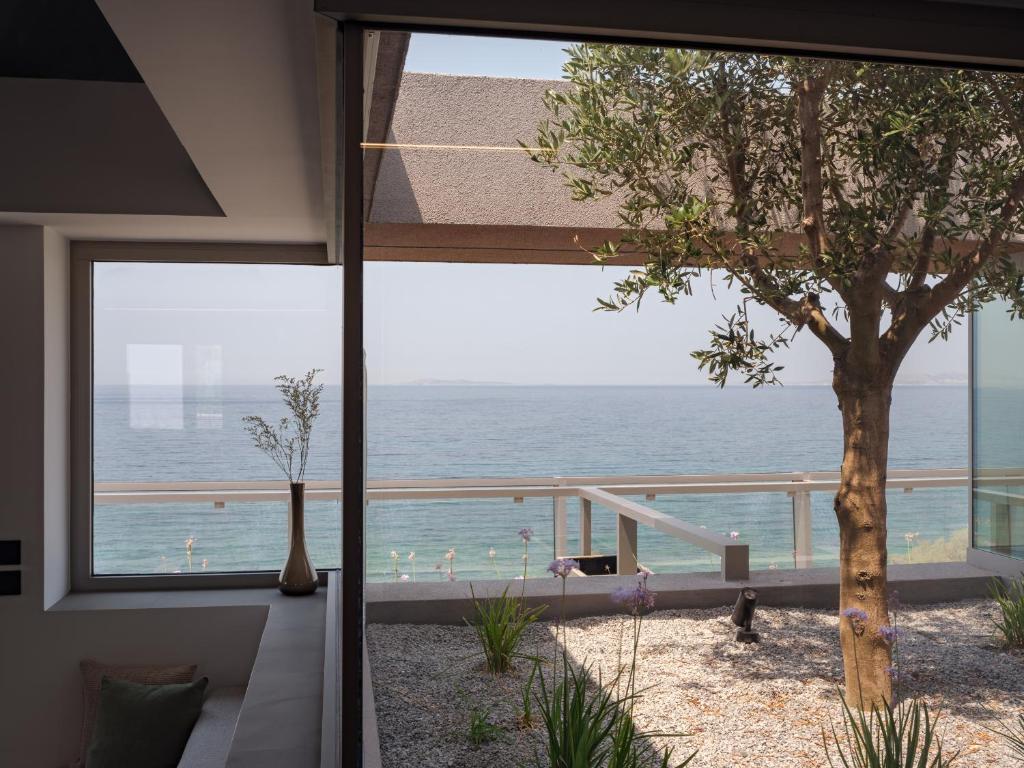 Апартаменты (Апартаменты в мансарде с видом на море) апарт-отеля 3 Olive Trees, Анависсос