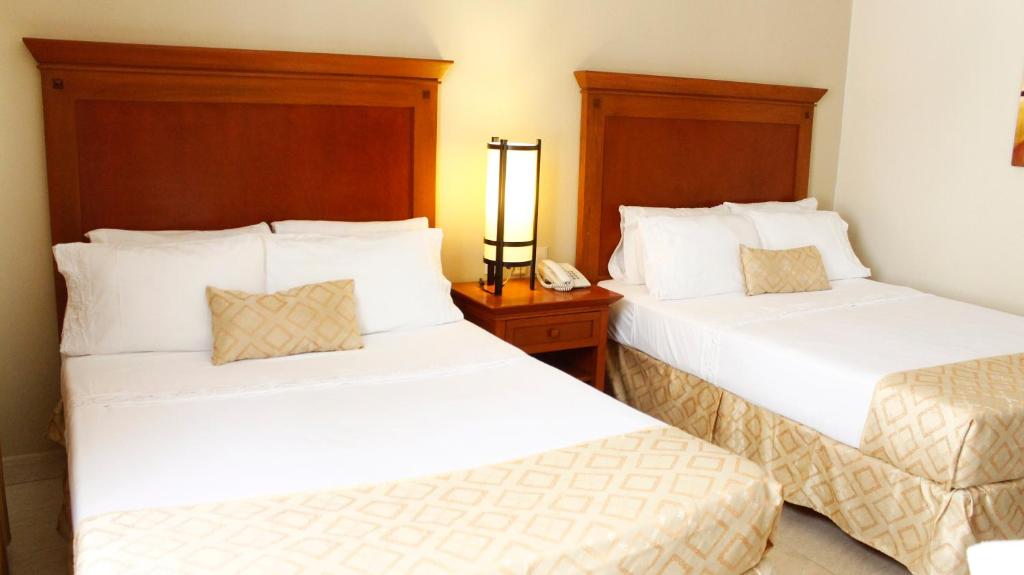 Двухместный (Номер с 2 кроватями размера «queen-size») отеля Hotel Magno Tepatitlán, Тепатитлан-де-Морелос