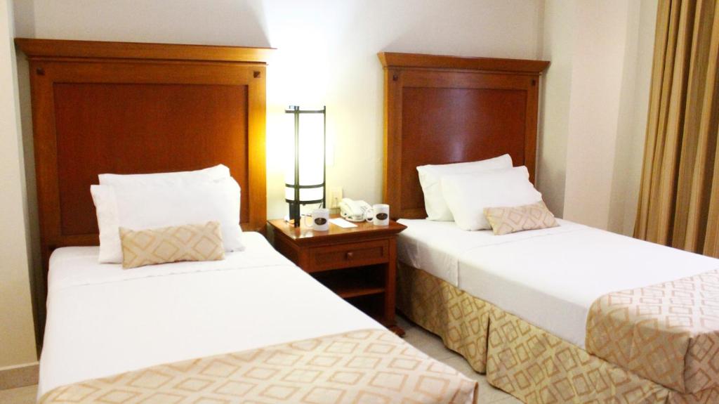 Двухместный (Двухместный номер с 2 отдельными кроватями) отеля Hotel Magno Tepatitlán, Тепатитлан-де-Морелос