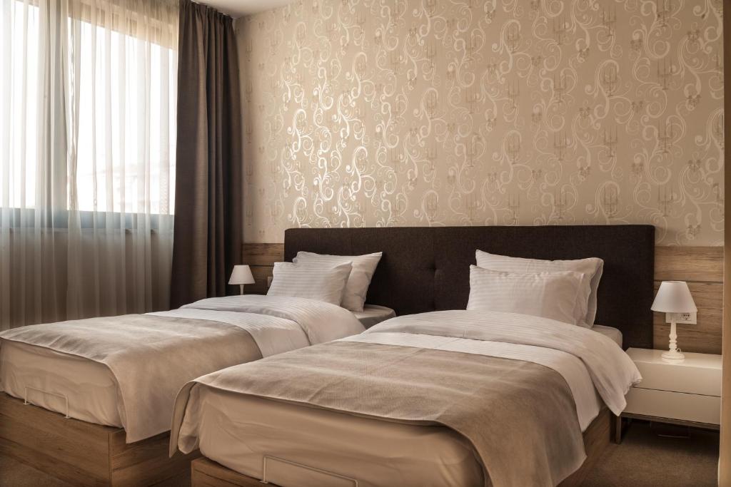 Двухместный (Двухместный номер Делюкс с 1 кроватью или 2 отдельными кроватями) отеля IG Hotel Garni, Горни Милановац