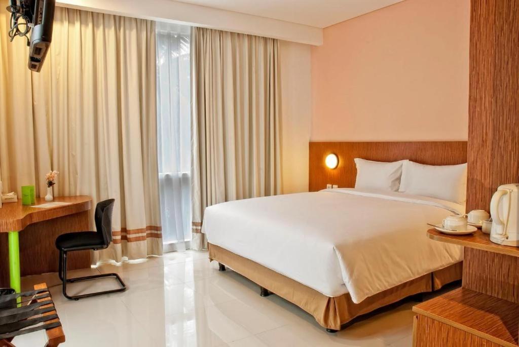 Двухместный (Улучшенный двухместный номер с 1 кроватью или 2 отдельными кроватями) отеля Pomelotel, Джакарта