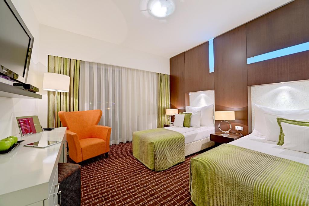 Двухместный (Улучшенный двухместный номер с 1 кроватью или 2 отдельными кроватями) отеля Hotel Cubix, Брашов