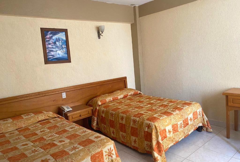 Двухместный (Двухместный номер с 2 двуспальными кроватями) отеля Hotel Sol del Pacifico, Ласаро Карденас