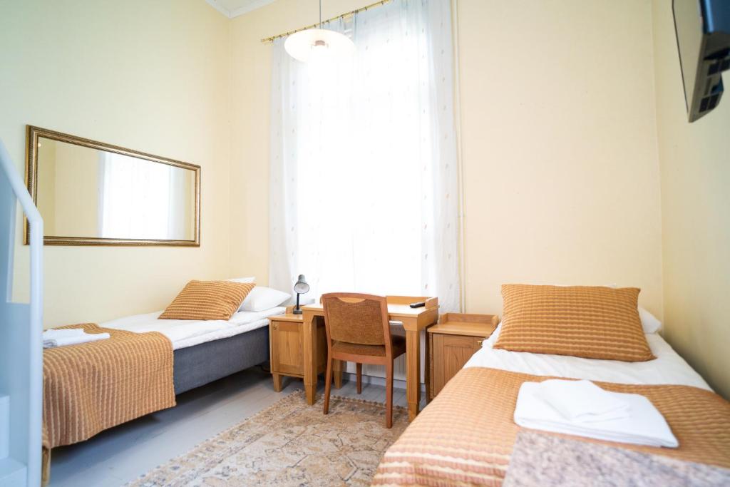 Двухместный (Улучшенный двухместный номер с 2 отдельными кроватями) отеля Summer Hotel Villa Aria, Савонлинна