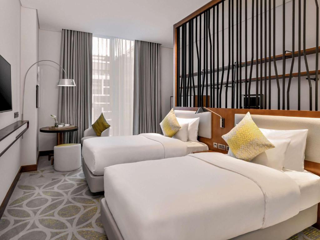 Двухместный (Улучшенный двухместный номер с 2 отдельными кроватями) апарт-отеля Grand Mercure Dubai Airport Hotel, Дубай