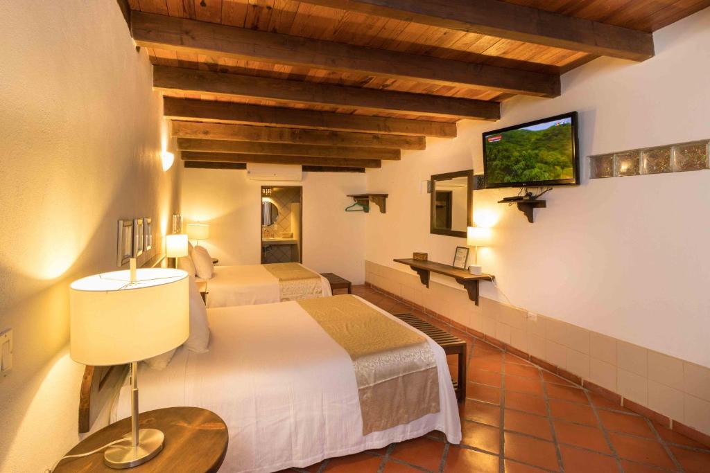 Двухместный (Двухместный номер Делюкс с 1 кроватью или 2 отдельными кроватями) отеля Hotel 1697 Loreto, Лорето
