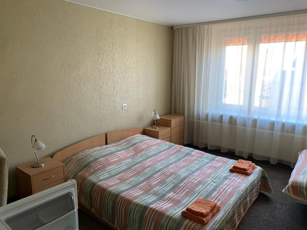 Двухместный (Двухместный номер с 1 кроватью или 2 отдельными кроватями и собственной внешней ванной комнатой) отеля Laisves 30, Мажейкяй