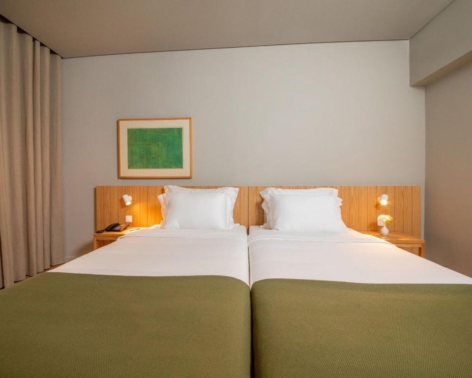 Двухместный (Двухместный номер с 2 отдельными кроватями, вид на сад) отеля Hotel Principe Perfeito, Визеу