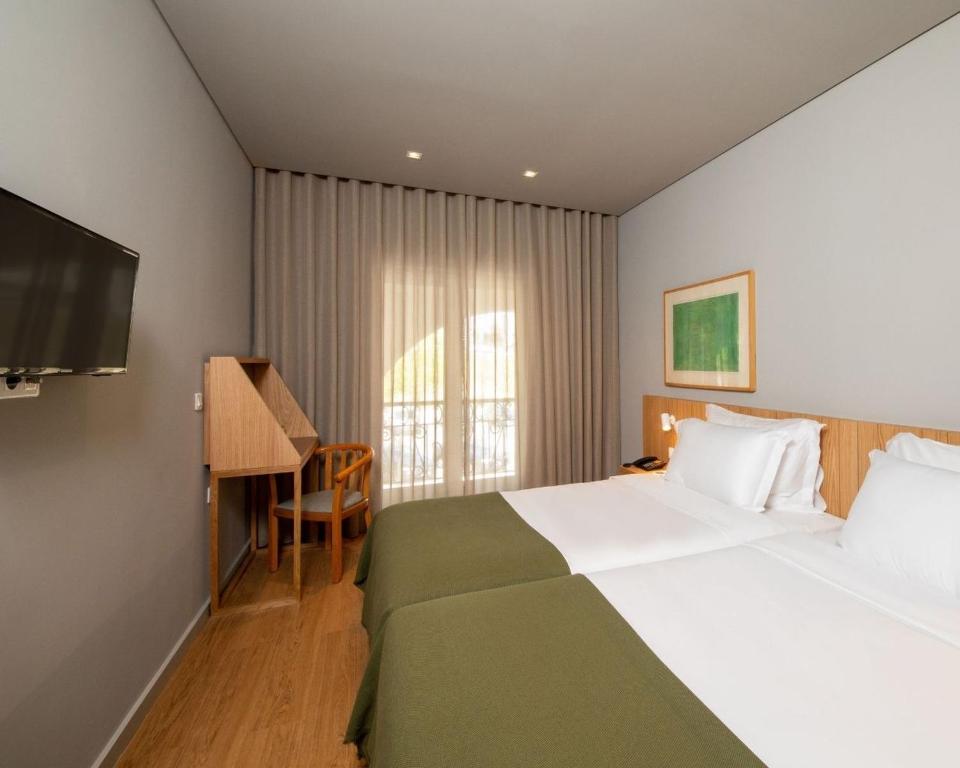 Двухместный (Двухместный номер с 2 отдельными кроватями и балконом) отеля Hotel Principe Perfeito, Визеу