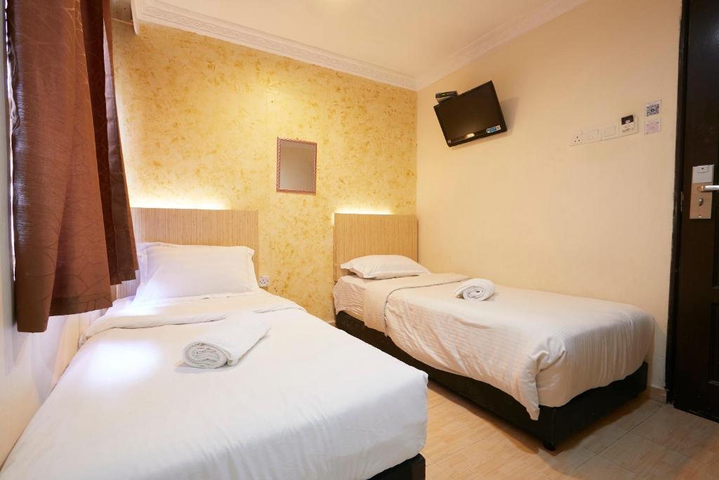 Двухместный (Стандартный двухместный номер с 2 отдельными кроватями) отеля Fast Hotel Setapak, Куала-Лумпур