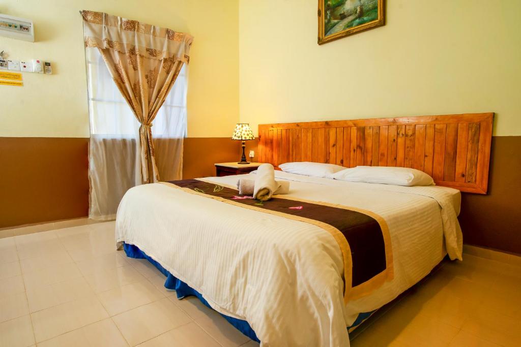 Двухместный (Номер с кроватью размера «queen-size» и видом на сад) мотеля NR Langkawi Motel, Лангкави