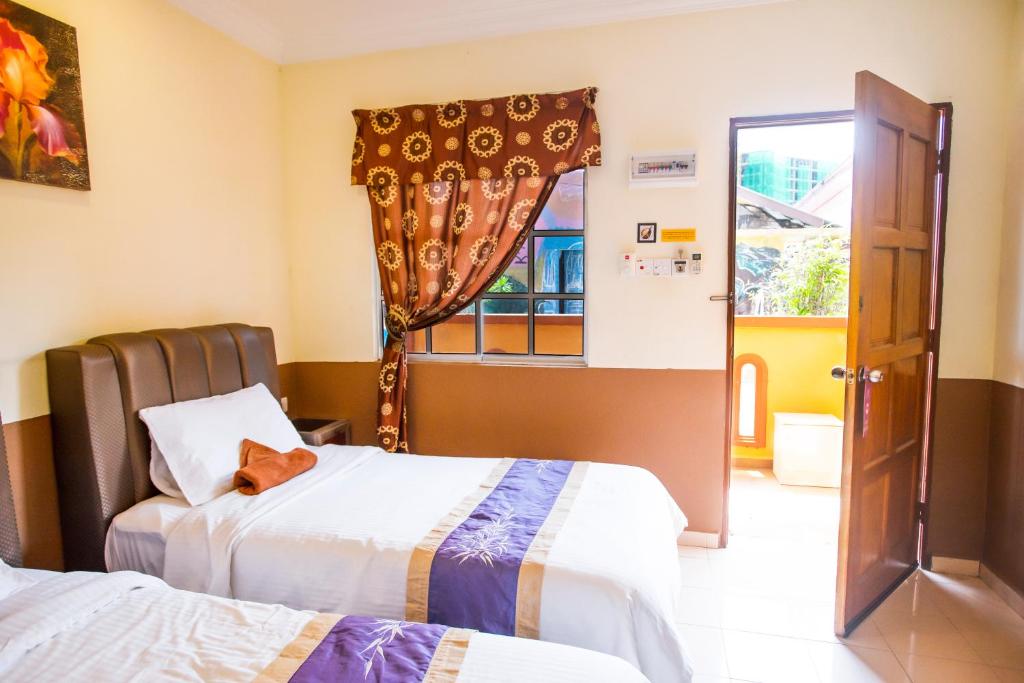 Двухместный (Двухместный номер с 2 отдельными кроватями и видом на бассейн) мотеля NR Langkawi Motel, Лангкави