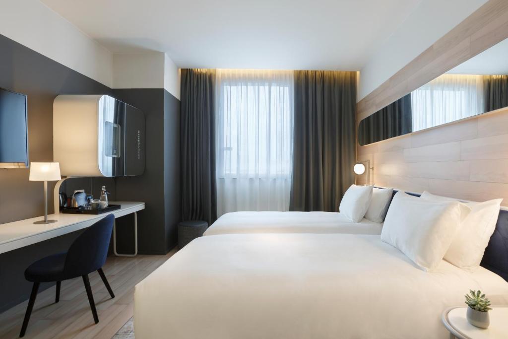 Двухместный (Стандартный двухместный номер с 2 отдельными кроватями) отеля Barceló Milan, Милан
