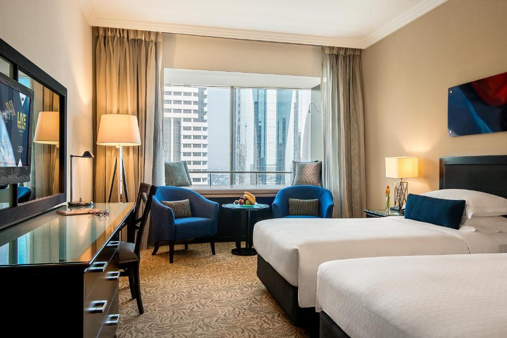 Двухместный (Номер Делюкс с 2 односпальными кроватями) отеля Towers Rotana - Dubai, Дубай
