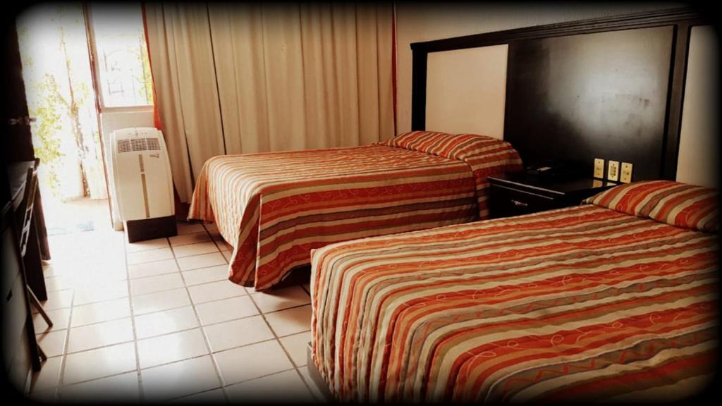 Двухместный (Двухместный номер с 2 двуспальными кроватями) отеля Hotel Florida Plaza, Дуранго