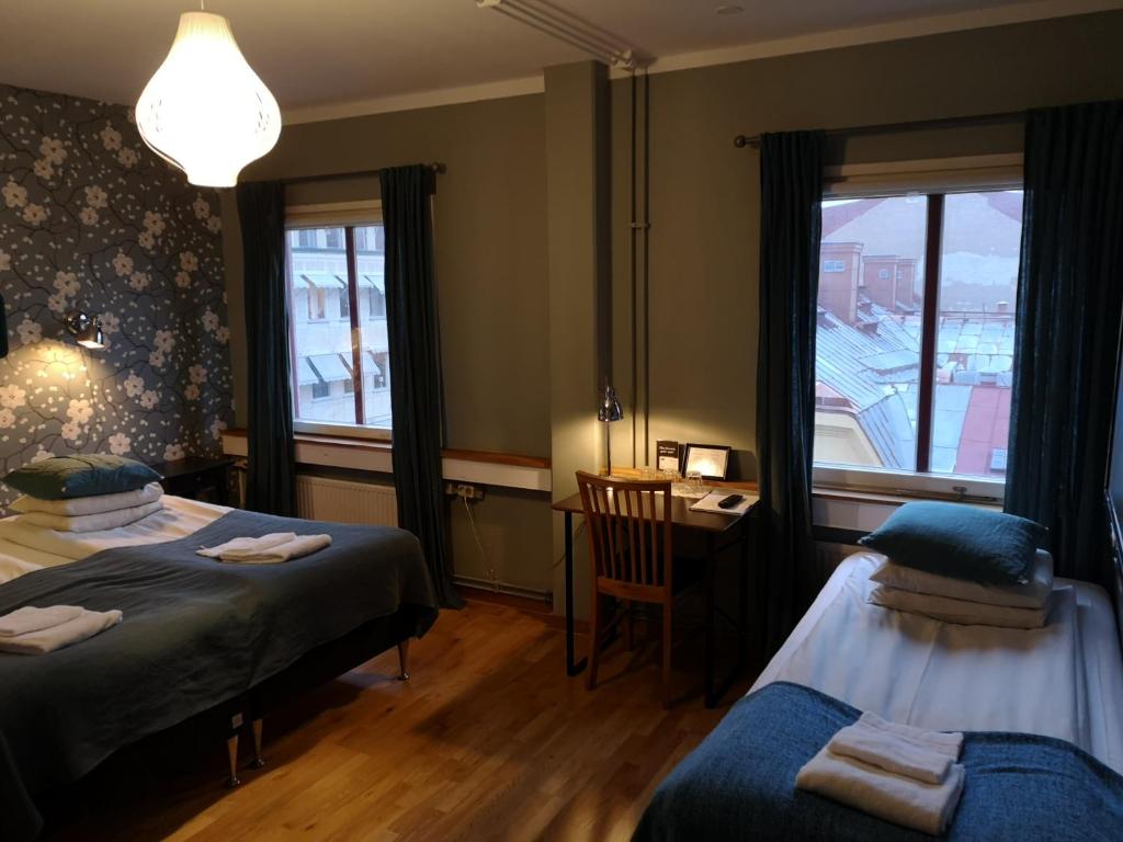 Трехместный (Трехместный номер с собственной ванной комнатой) отеля Uppsala CityStay Hotel, Уппсала