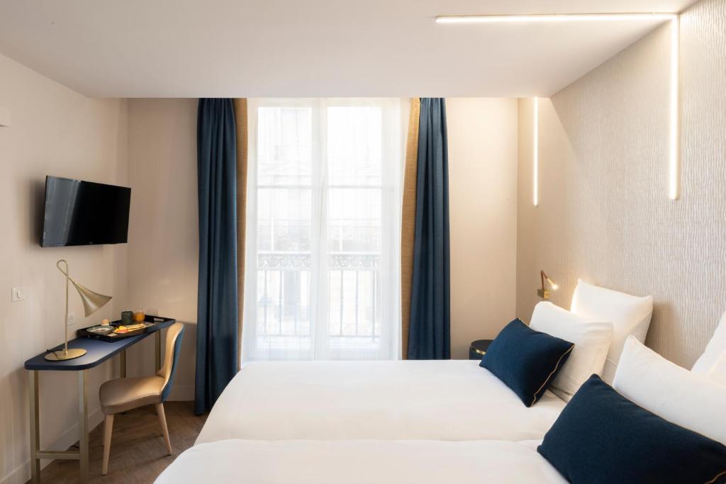 Двухместный (Улучшенный двухместный номер с 2 отдельными кроватями) отеля Hôtel Mercure Paris Opéra Lafayette, Париж