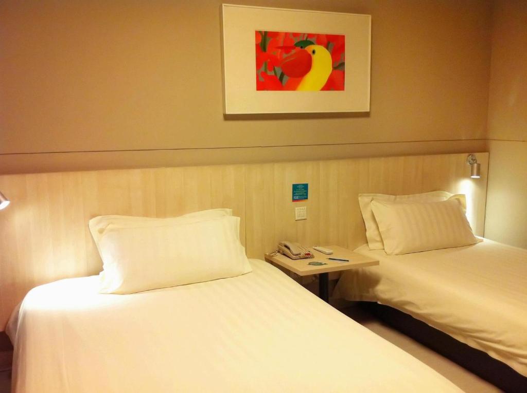Двухместный (Стандартный двухместный номер с 2 отдельными кроватями) отеля Jinjiang Inn Changsha Dongfeng Road, Чанша