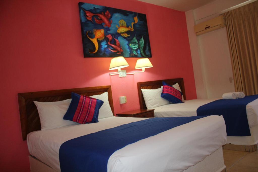 Двухместный (Двухместный номер с 2 двуспальными кроватями) отеля Hotel Arenas del Pacifico, Санта-Крус-Хуатулко